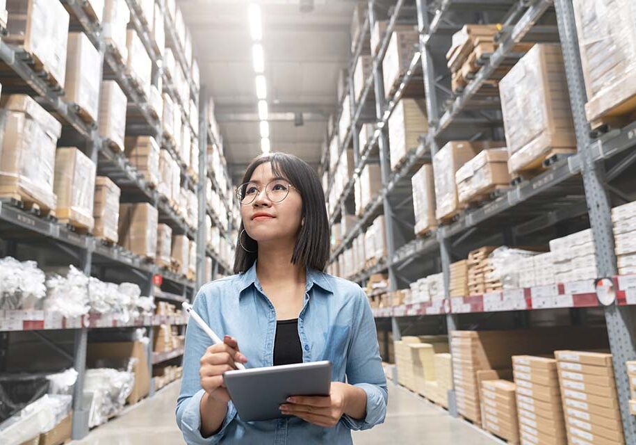 candid-young-attractive-asian-woman-auditor-trainee-staff-work-looking-up-stocktaking-inventory